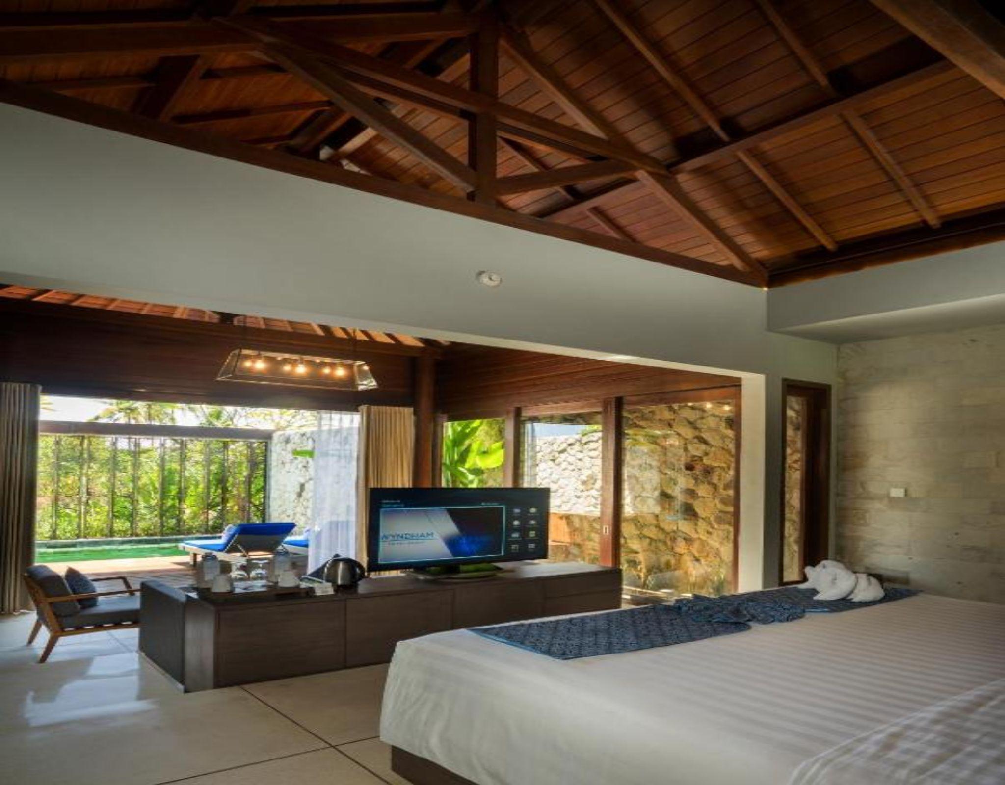 Wyndham Tamansari Jivva Resort Bali Siyut Exteriér fotografie A bedroom at the resort